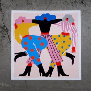Illustration titled "Women - Giclée" features three stylised women arm-in-arm, dressed in vibrant clothes with stars, stripes, and polka dots—a unique artwork ideal as a memorable Tallinn shopping souvenir. Gate21.ee