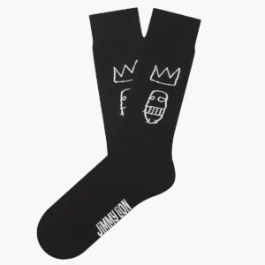 The Basquiat Sugar Ray Robinson - Regular is a single black sock with two white, sketch-style crowned faces and the JIMMY LION logo on the foot—an ideal gift shop pick for anyone wanting a unique idea. Gate21.ee