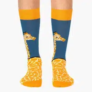 Giraffe - Regular socks feature yellow tops and heels, blue shafts with giraffe faces, plus orange and white spots on the feet; available at Tallinn shopping hotspots—an ideal gift shop find. Gate21.ee