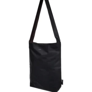 The Feel Good Bag - Black is a rectangular shoulder bag featuring a long strap, minimalistic design, and a small white logo near the top centre. Crafted in the signature style of Tinne+mia’s Feel Good Bag, it boasts smooth, slightly shiny material for an elegant finish. Gate21.ee