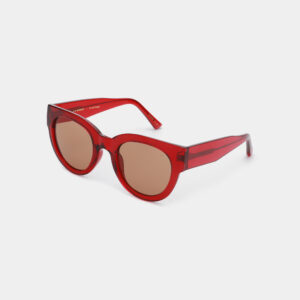 The LILLY - Red Transparen sunglasses feature red, round frames and brown tinted lenses, designed for modern gift shops and showcased against a plain white background. Gate21.ee
