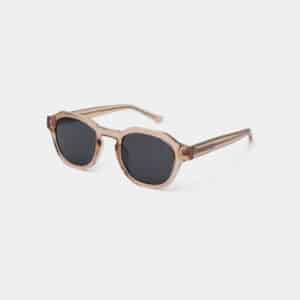 The ZAN - Champagne sunglasses feature translucent beige plastic frames with dark lenses and slightly angled arms, shown against a plain white background—an eye-catching accessory for your next shopping spree in Tallinn. Gate21.ee