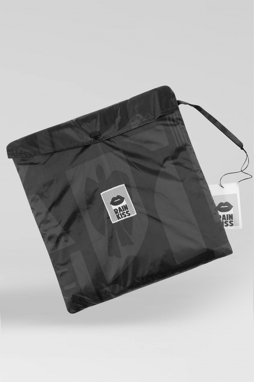 Back to Black is a black, square zippered pouch with a wrist strap and a white RAINKISS tag—perfect for concept shops after standout pieces. Photographed on a plain light grey background. Gate21.ee
