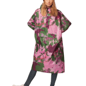 Wearing the Digi Spring long, loose-fitting coat with a pink and green floral pattern, burgundy beanie, dark jeans, and white trainers, she exudes effortless chic—ideal for browsing Tallinn shops or visiting a concept store. Gate21.ee