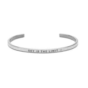 The Musi bracelet is a slim, open-ended silver piece engraved with "SKY IS THE LIMIT" and features a small round detail—ideal for Tallinn shopping and celebrating Estonian design. Gate21.ee