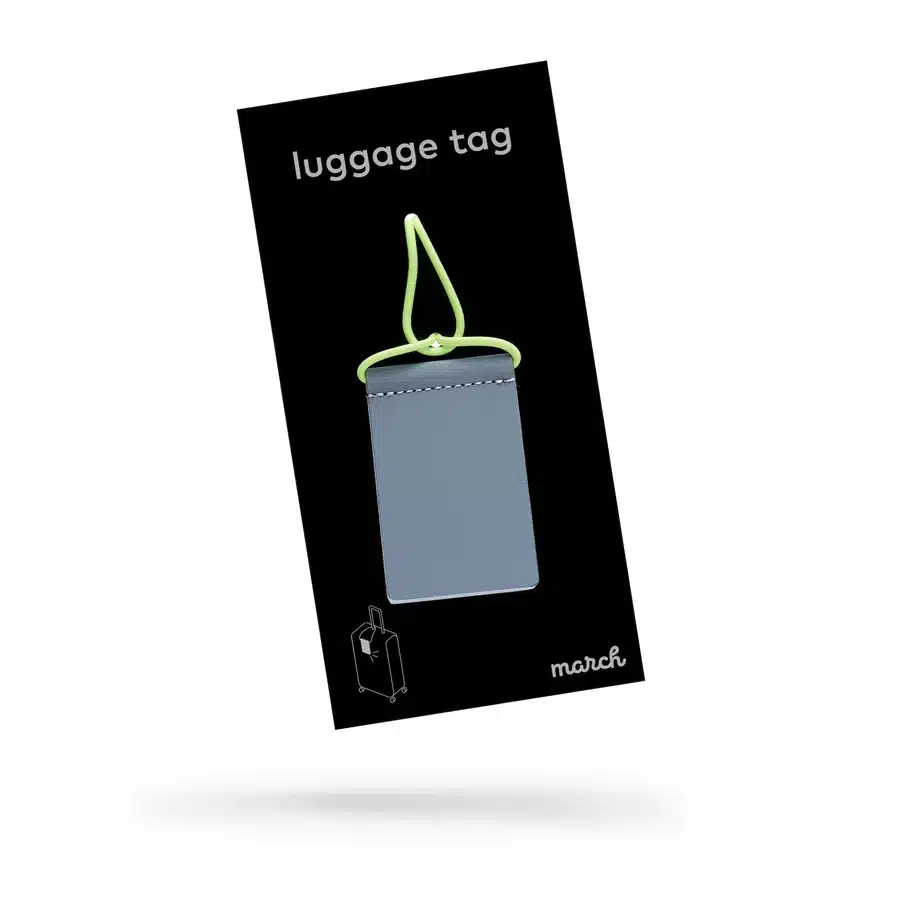 A neon yellow luggage tag with a matching loop is shown on black packaging labelled "Luggage Tag" in white, featuring the brand name march and a suitcase icon&mdash;ideal for curated concept stores or stylish gift shops. Gate21.ee