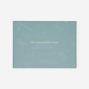 A rectangular blue-green box labelled Games for Grown-ups rests on a plain white background, decorated with curated illustrations of everyday objects on its surface. Gate21.ee