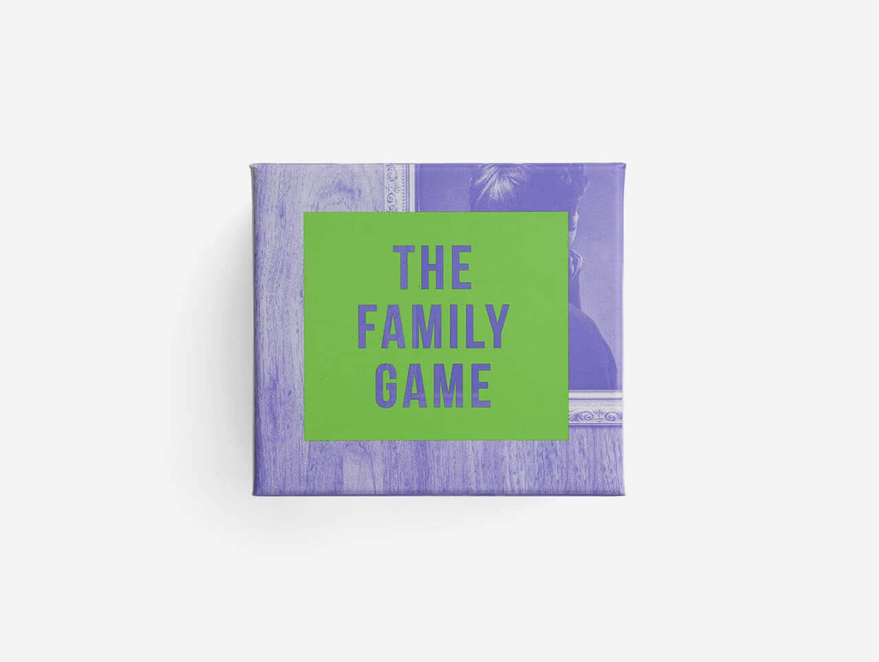 A purple box with a green square label on the front displays GAMES FOR GROWN-UPS in bold letters. The background has faint images of a person and picture frame, making it ideal for concept shop shelves or anyone seeking unique gift ideas. Gate21.ee