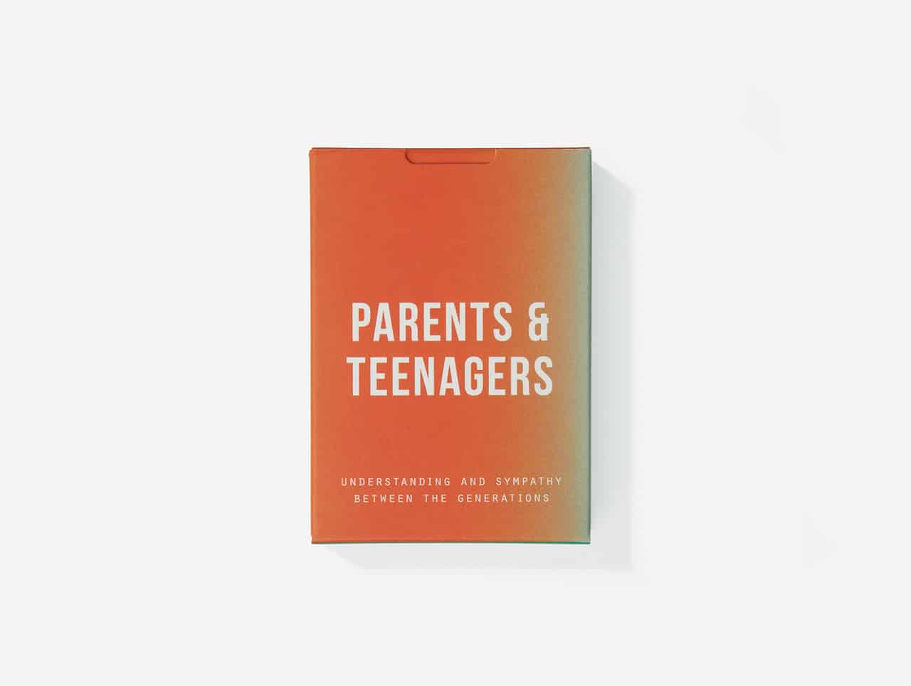 A box with an orange and green gradient labelled "Parents & Teenagers Game" features the subtitle "Understanding and sympathy between the generations" in white, photographed on a plain white background—perfect for curated concept shops or Tallinn retail spaces. Gate21.ee