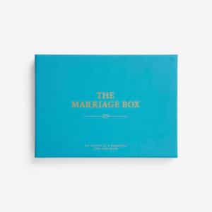 A rectangular turquoise box with gold text on the lid reading "Parents & Teenagers Game." Perfect for Tallinn shopping or as a local gift shop find, it features a smaller, partially legible gold line below on a plain white background. Gate21.ee