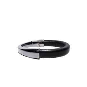 The ERER - Silver - Asymmetrical Bracelet features a black leather thick band with a silver metallic clasp, showcasing Estonian design and displayed on a plain white background. Gate21.ee