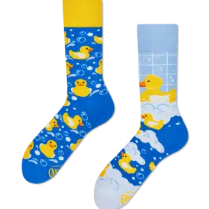 Fisher’s Tale: A fun pair of mismatched socks—one with a yellow cuff featuring rubber ducks and bubbles, the other with a light blue cuff, ducks, bubbles, and white soap suds. Perfect for gift shops or concept stores. Gate21.ee