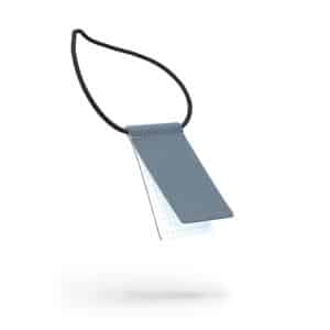 A black luggage tag photographed against a white background with a soft shadow—an example of curated Estonian design to help organise your unique travel essentials. Gate21.ee