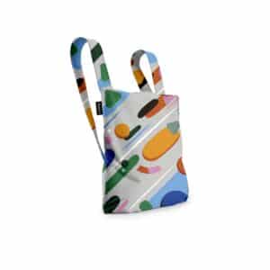 The Fruit Salad - Notabag is a fabric rucksack with two straps and a vibrant abstract pattern, inspired by Estonian design. Shown on a white background, it's ideal for Tallinn shopping or as a unique local gift shop find. Gate21.ee