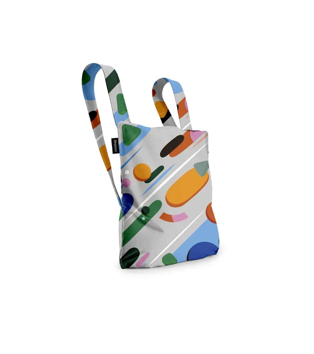 The Fruit Salad - Notabag is a fabric rucksack with two straps and a vibrant abstract pattern, inspired by Estonian design. Shown on a white background, it's ideal for Tallinn shopping or as a unique local gift shop find. Gate21.ee