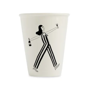 The Wine O'clock Cup is a white mug with a playful illustration of a woman in a striped jumpsuit holding a wine bottle and glass—an example of curated Estonian design, ideal for gift shops. Gate21.ee
