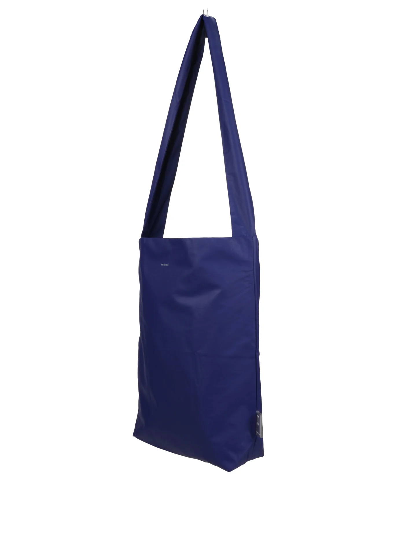 The Feel Good Bag - Sodalite Blue is a minimalist rectangular tote with a long single strap, shown hanging against a white background. This Tinne+mia bag features no visible patterns or decorations. Gate21.ee