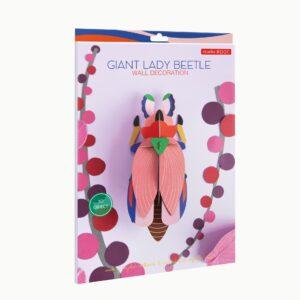 A package labelled Giant Ladybird showcases a colourful, 3D beetle model with pink wings and green, blue, and orange accents on illustrated branches, inspired by Estonian design. Gate21.ee
