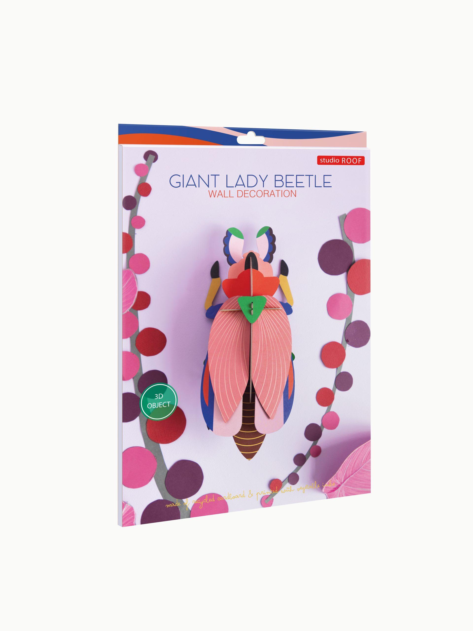 A package labelled Giant Ladybird showcases a colourful, 3D beetle model with pink wings and green, blue, and orange accents on illustrated branches, inspired by Estonian design. Gate21.ee