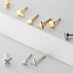 The ZEN 925 Sterling Silver Earrings set features small studs in X, heart, triangle, and circle shapes with gold and silver finishes&mdash;an ideal way to add a touch of Estonian design to any outfit. Gate21.ee