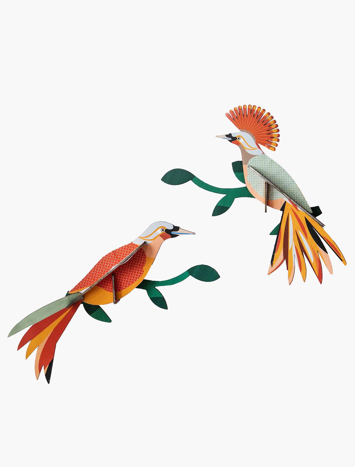 Paradise Bird Obi features two colourful paper birds perched on green branches, with striking orange, yellow, and red patterns. Ideal for Tallinn shopping or unique gifts, this vibrant piece brightens any shop or collection. Gate21.ee