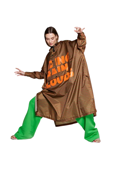 A person poses against a plain white background wearing bright green wide-legged trousers, inspired by the Breton Green Diary—a look that channels the curated, unique style of a concept shop. Gate21.ee