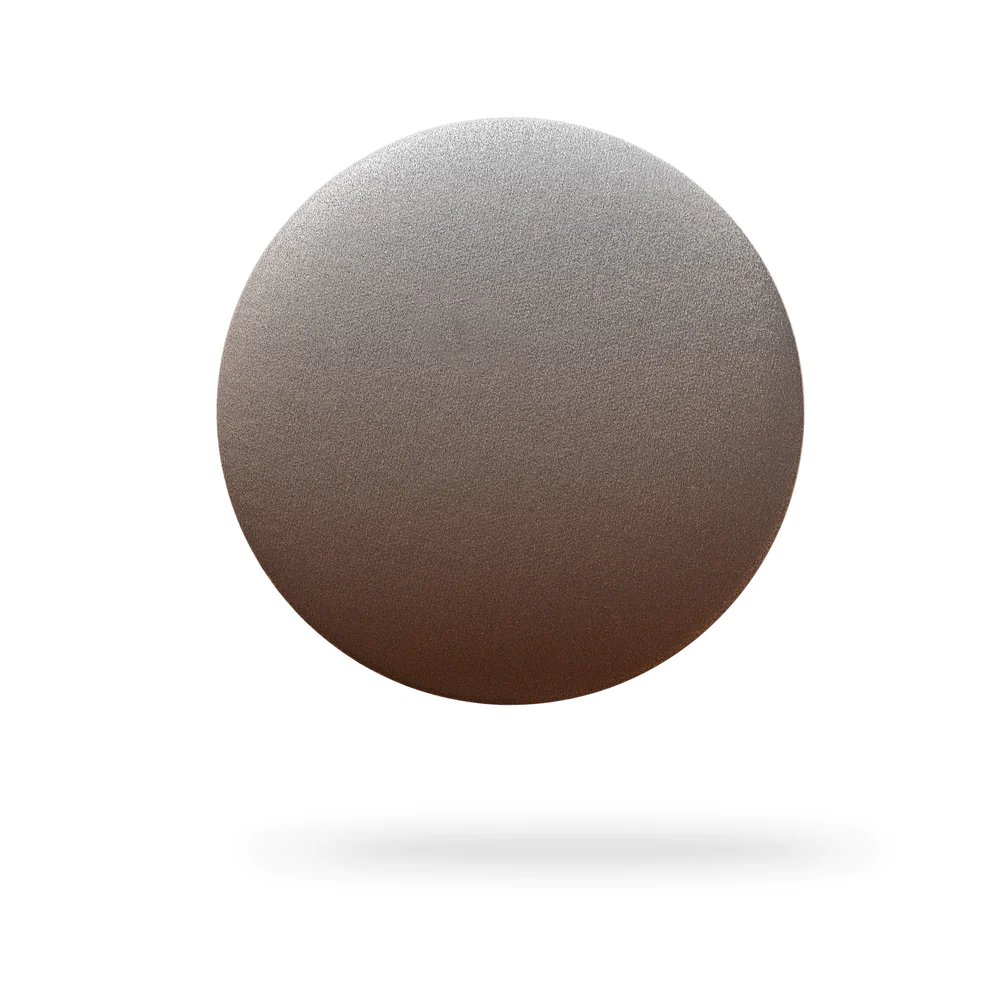 The Single – Fade Black features a single, round metallic disc with a gradient from silver at the top to bronze at the bottom, set against a white background with a soft shadow—ideal for unique ideas or concept shop inspiration. Gate21.ee