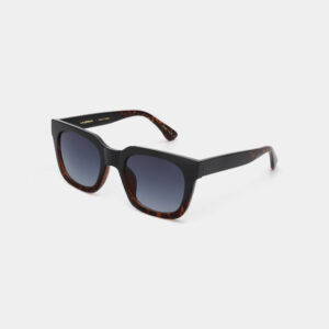The NANCY - Black Demi Tortoiseshell sunglasses feature square frames in black and tortoiseshell, dark gradient lenses, and angular arms&mdash;ideal for curated, unique gifts. Displayed on a light grey background. Gate21.ee