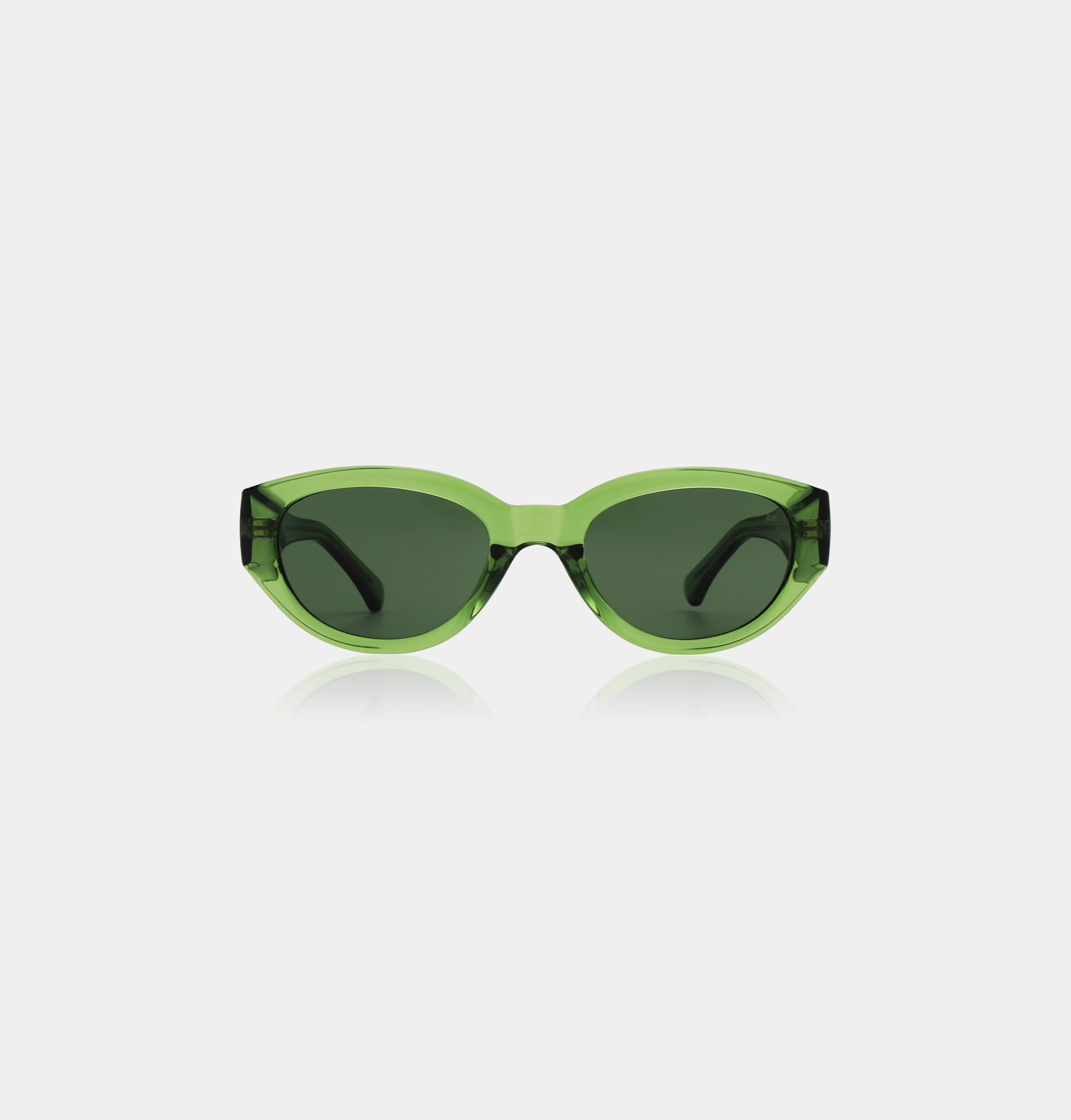 WINNIE - Light Olive Transparent sunglasses feature a slightly cat-eye frame and dark lenses, perfect for those seeking unique style ideas, shown against a plain white background. Gate21.ee