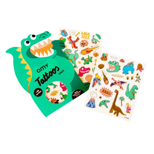 A dinosaur-shaped Kawaii - Temporary Tattoos package, inspired by Estonian design, includes two sheets of colourful cartoon dinosaur, plant, and volcano temporary tattoos—ideal for gift shops or concept stores. Gate21.ee