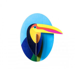 Toucan – a flat Estonian-inspired illustration featuring a layered, cut-out paper design with a bright yellow beak accented by pink stripes, set against a blue oval background. Gate21.ee