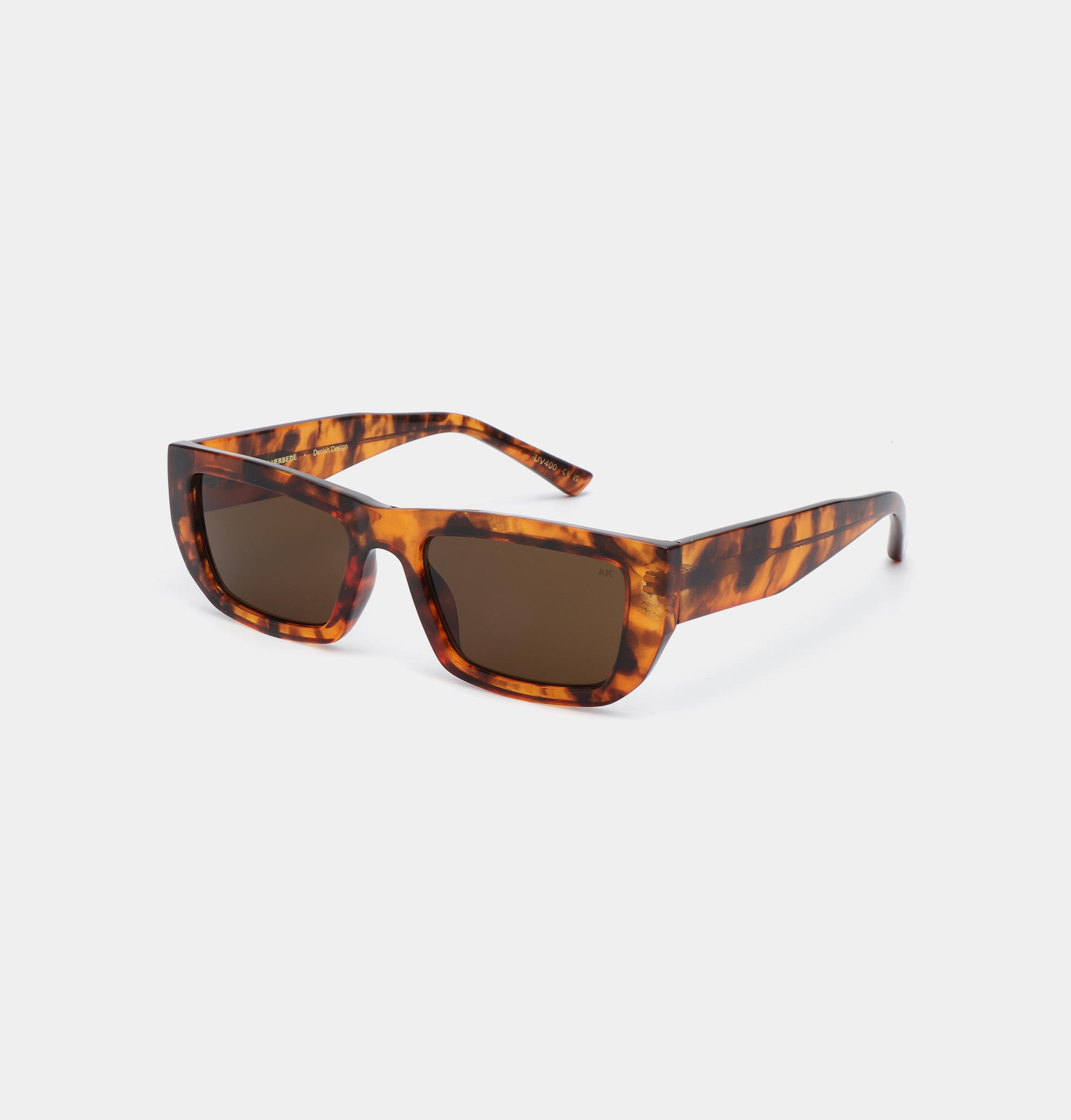 FAME - Havana: Tortoiseshell rectangular sunglasses with dark brown lenses, inspired by Estonian design, shown at a three-quarter angle on a plain white background. Gate21.ee