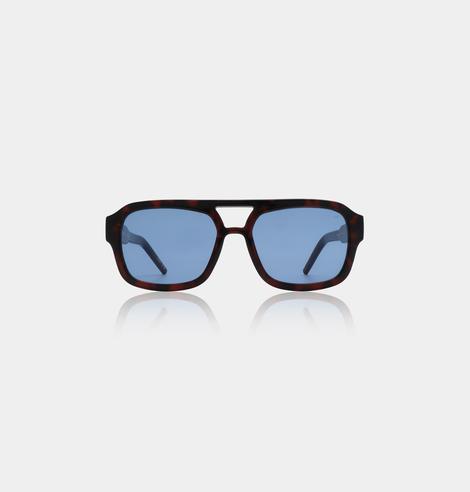 KAYA - Demi tortoise blue lenses: Stylish sunglasses with a dark tortoiseshell frame and blue-tinted rectangular lenses, shown on a light grey background—an ideal accessory for your Tallinn shopping spree or favourite concept store. Gate21.ee