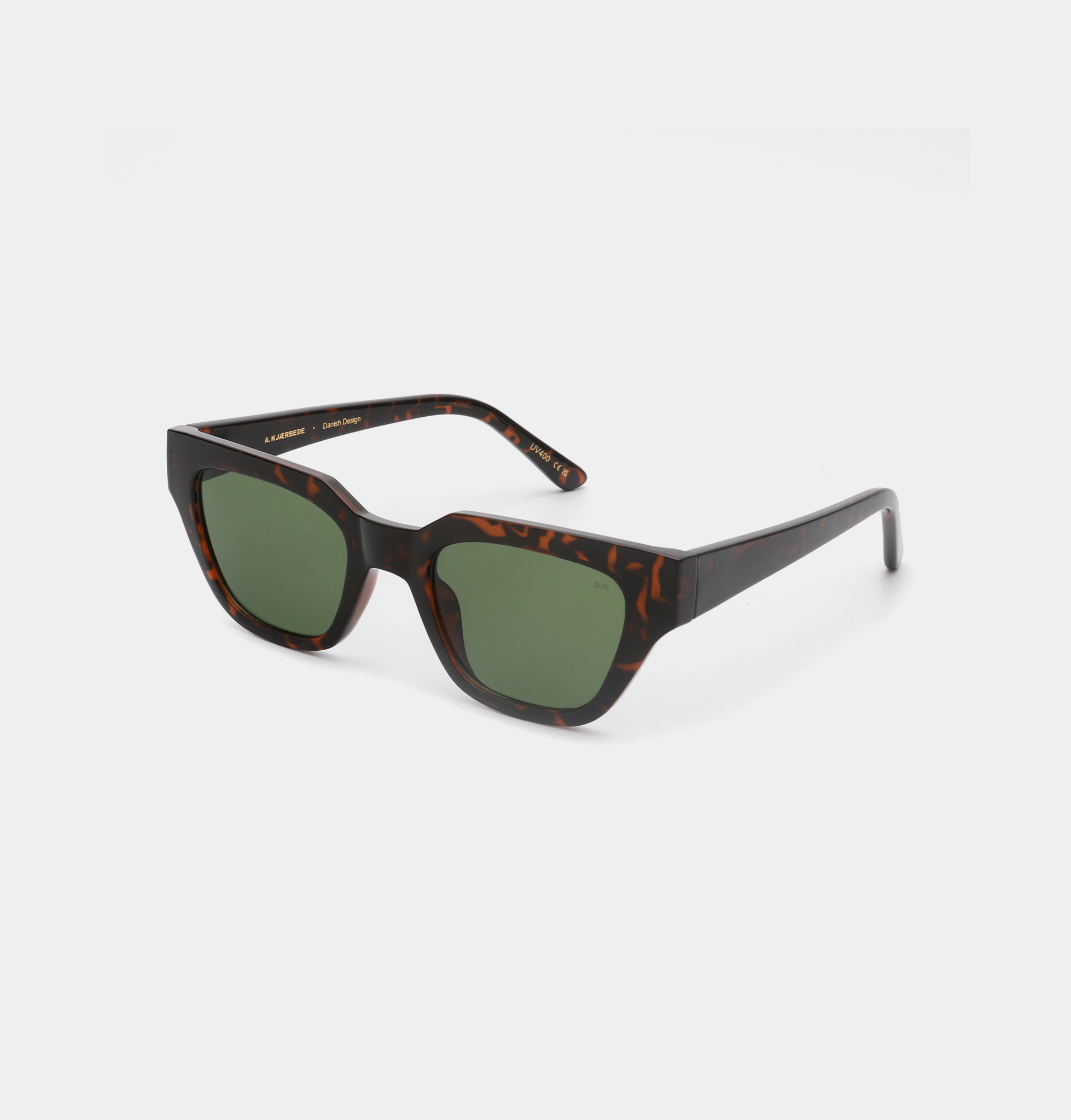 The KAWS - Demi Tortoise features green rectangular lenses and a thick, dark tortoiseshell frame—ideal for finding unique ideas at your favourite Tallinn shopping gift shop. Gate21.ee