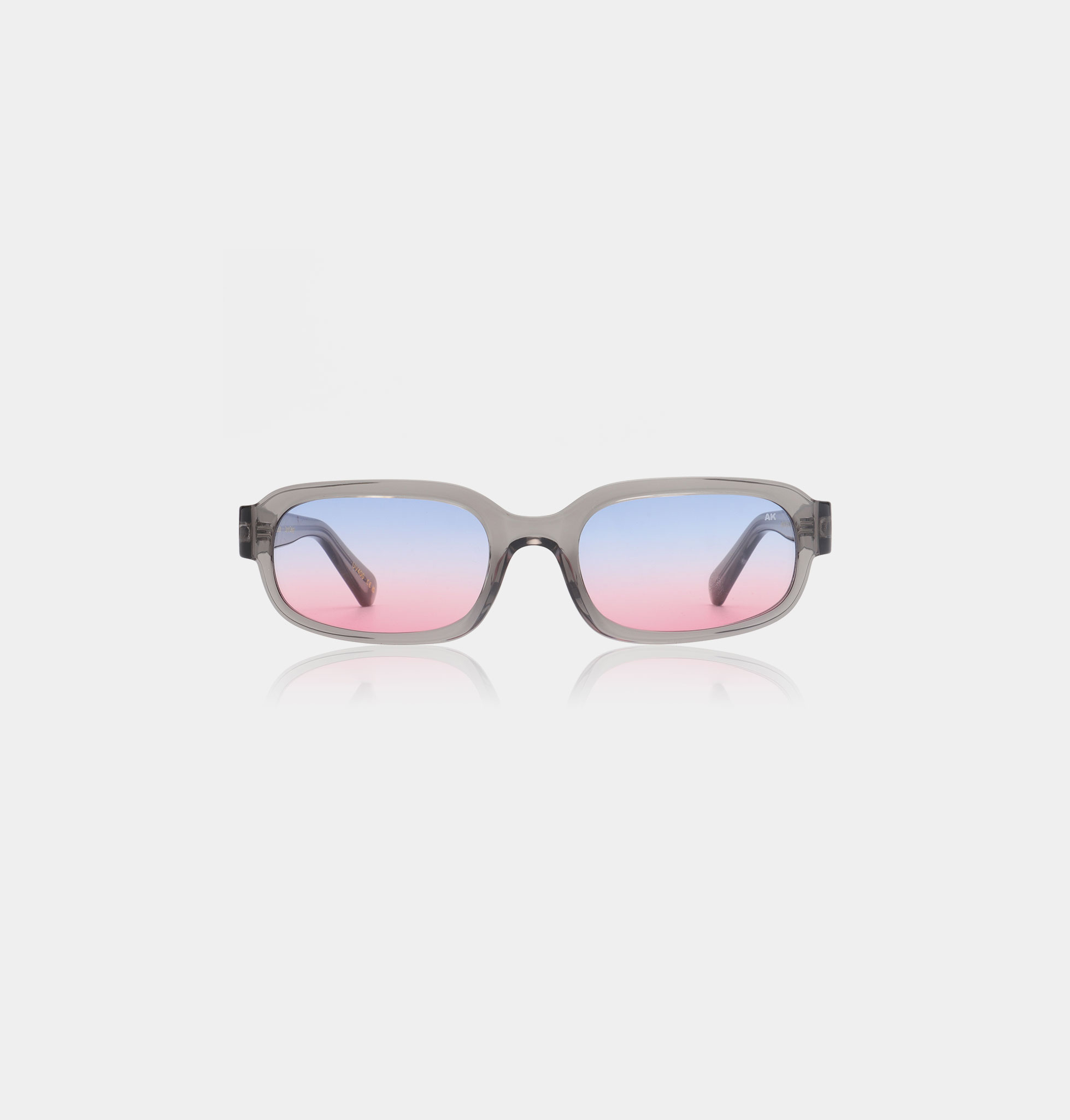 The WILL - Grey Transparent sunglasses feature rectangular frames in transparent grey and lenses that fade from blue to pink, inspired by Estonian design, displayed on a plain white background. Gate21.ee