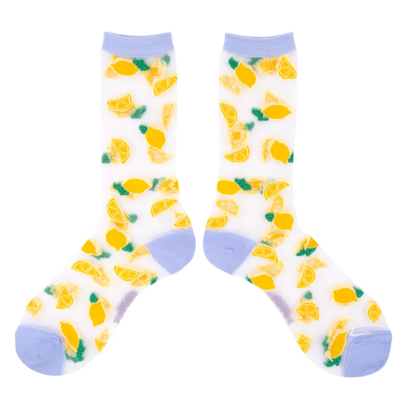Lemons - Transparent Socks: White socks with light blue toe, heel, and cuff, featuring a playful pattern of yellow lemons and lemon slices with green leaves. Curated for a concept shop to give your style a unique twist. Gate21.ee