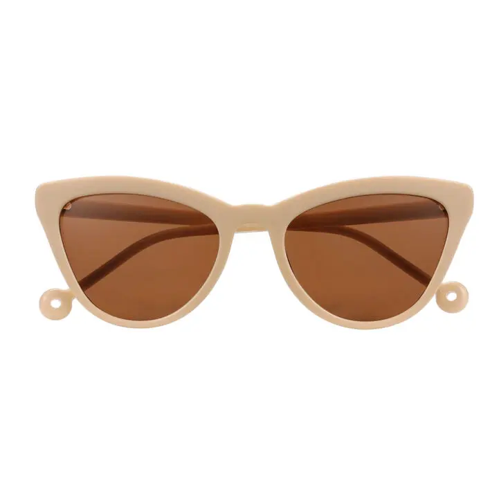 The "Colina" Creamy Sunglasses feature cat-eye beige frames, brown lenses, and small circular loops—ideal for concept shops or gift shops. Gate21.ee