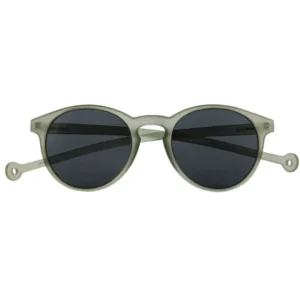 The "Isla" Moss Sunglasses feature round, grey frames with black lenses, small circular holes near the temple ends, and a matt finish—a distinctive Estonian design perfect for any gift shop seeking unique items. Gate21.ee