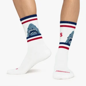 Jaws - Athletic: White crew socks with red and navy stripes, featuring a shark graphic and the brand JIMMYJOHN in red on the sole—a fun Estonian design to add flair to your Tallinn shopping adventures. Gate21.ee