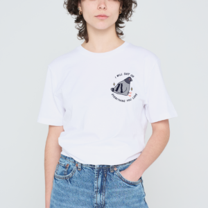 A person with short curly hair wears a pink Love Me Worm T-shirt paired with high-waisted blue jeans, standing against a plain light background. Gate21.ee