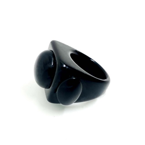 The Black Widow - Ring is a matte black, chunky geometric piece with two raised ovals on its broad top—an ideal modern gift for anyone seeking unique style. Gate21.ee