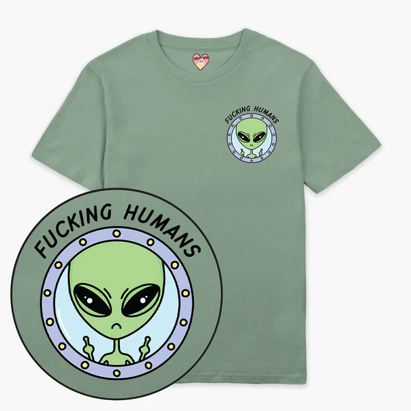 The F*cking Humans T-Shirt - Green features a small chest graphic of an alien in a spaceship window with the words "F*cking Humans," making it a quirky pick for your Tallinn shopping spree. Gate21.ee