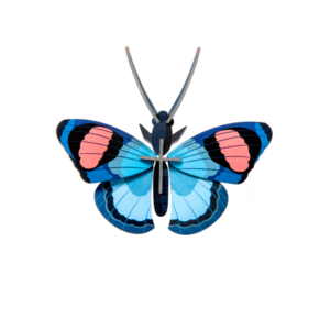 The Peacock Butterfly features blue wings with black edges and pink ovals near the top, highlighting curated Estonian design. Displayed on a white background, it’s perfect for any gift shop. Gate21.ee