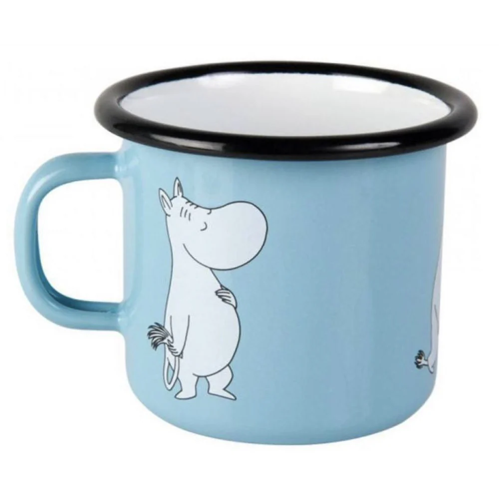 The Moomin - Enamel mug blue 2.5dl features a light blue finish, black rim, and a cheerful standing Moomin character illustration. This Estonian-designed mug has a large left-side handle for easy grip. Gate21.ee
