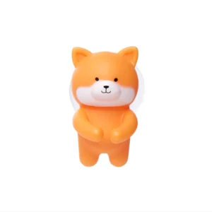 A small, orange sloth toothbrush holder with rounded ears, short limbs, and a white face is shown against a plain white background—perfect for Tallinn shopping or as a unique curated gift shop find. Gate21.ee