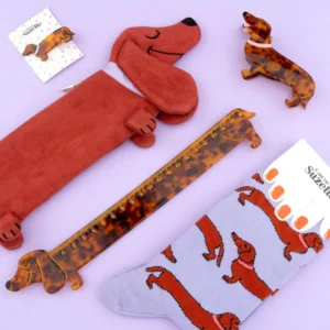 Dachshund - Cotton Socks: dachshund-themed cotton socks on a light purple surface—fun, unique Estonian design and perfect for any concept shop. Gate21.ee