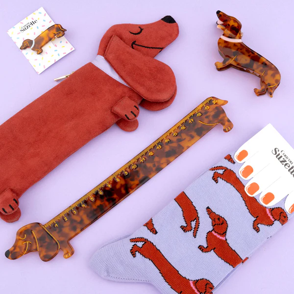 Dachshund - Cotton Socks: dachshund-themed cotton socks on a light purple surface—fun, unique Estonian design and perfect for any concept shop. Gate21.ee