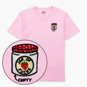 The Jam Jar T-Shirt - Pink features a light pink design with an embroidered patch of a strawberry jam jar labelled JAR OF F*CKS and EMPTY below, inspired by Tallinn’s concept shops. Patch appears on the left chest. Gate21.ee