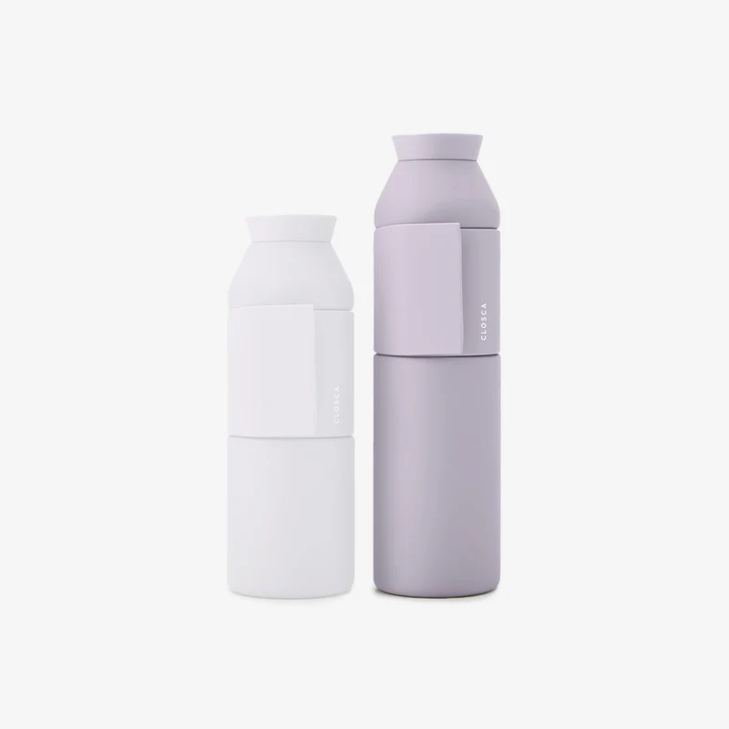 Two Closca Wave – Himalaya 600ml reusable bottles stand side by side on a plain white background, their minimalist design and small rectangular handles making them ideal for unique Tallinn shopping finds or thoughtful local presents. Gate21.ee