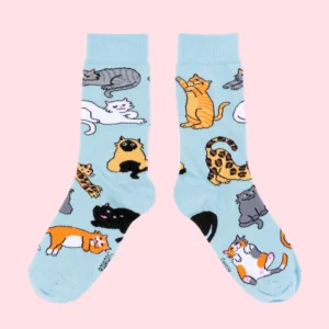 Meow - Cotton Socks: Light blue socks featuring playful cartoon cats on a pink background—an ideal choice in Tallinn or for anyone after unique concept shop finds. Gate21.ee